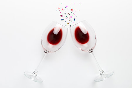 Many glasses of red wine at wine tasting. Concept of red wine on colored background. Top view, flat...