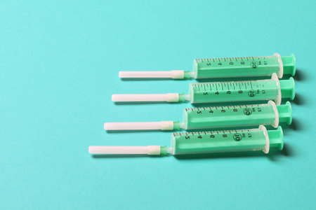Top view of different injection syringes on colorful background. Medical equipment concept with copy space.の写真素材