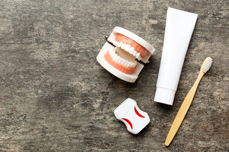 Mouthwash and other oral hygiene products on colored table top view with copy space. Flat lay. Dental hygiene. Oral care kit. Dentist concept.の写真素材