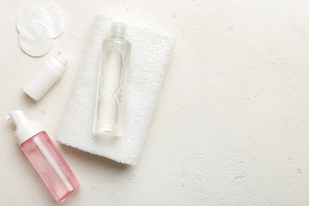 Micellar cleansing water and discs to remove cosmetics and cleanse the skin on colored background. Copy space top view.の写真素材