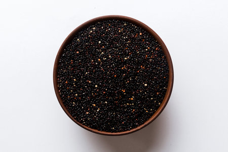 quinoa seeds in bowl on colored background. Healthy kinwa in small bowl. Healthy superfood.の写真素材