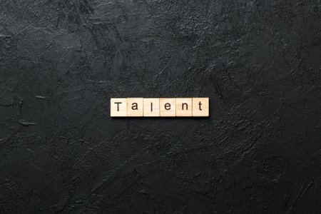 Talent word written on wood block. Talent text for your design, concept.の写真素材