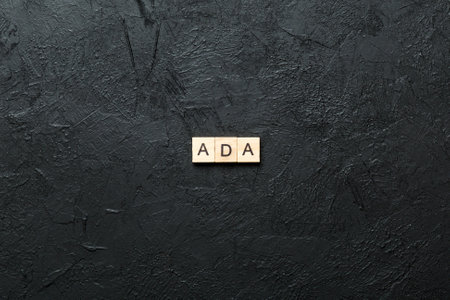 ADA word written on wood block. ADA text on table, concept.の写真素材