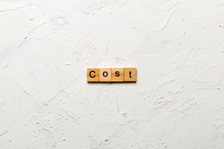 COST word written on wood block. COST text on table, concept.の写真素材