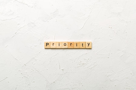 priority written word on wood block. priority text on table, concept.の写真素材
