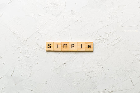 simple written word on wood block. simple text on table, concept.の写真素材