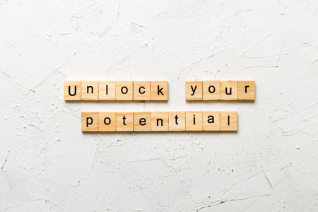 unlock your potential word written on wood block. unlock your potential text on table, concept.の写真素材