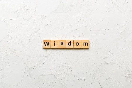 wisdom word written on wood block. wisdom text on table, concept.の写真素材