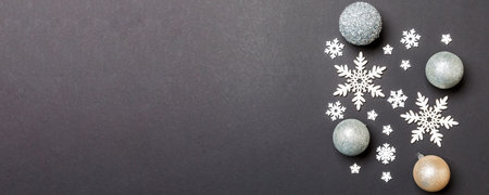Creative set of New Year baubles and decorations on colorful background. Top view of Christmas time concept. Copy space.の写真素材