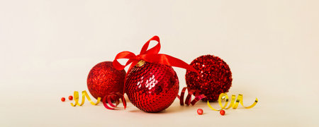 Christmas ball on colored background. decoration bauble with ribbon bow with copy space.の写真素材