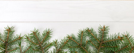 Christmas wooden background with fir tree frame and copy space. top view empty space for your design.の写真素材