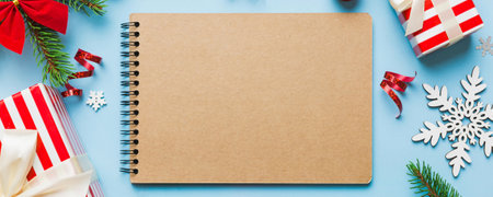 Christmas blank greeting card mock-up scene. Creative layout made of Christmas tree branches and paper card note. Flat lay. Nature New Year concept.の写真素材