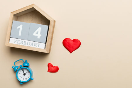 Valentine Day theme with wooden block calendar. Greeting card template for Valentines Day. Top view, copy space for text.の写真素材
