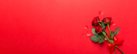 Valentine day composition with rose flower and red heart on table. Top view, flat lay, copy space...