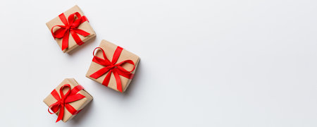 Valentine day composition: red gift box with bow and heart. Christmas present. View from above. Space for text. Holday greeting card.の写真素材