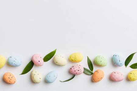 Happy Easter concept. Preparation for holiday. Easter eggs on colored background. flat lay top view copy space banner.の写真素材