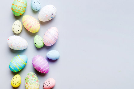 decorative easter eggs on colored background. easter eggs collection top view with copy space.の写真素材