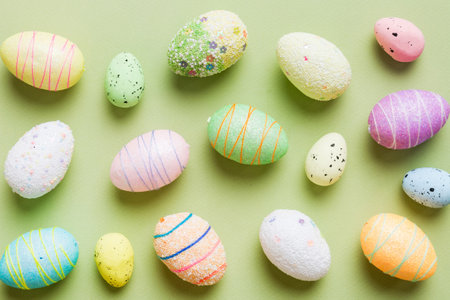 decorative easter eggs on colored background. easter eggs collection top view with copy space.の写真素材