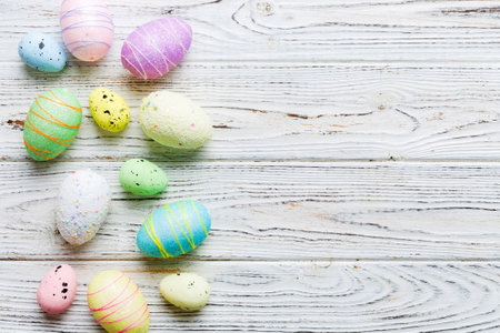 decorative easter eggs on colored background. easter eggs collection top view with copy space.の写真素材