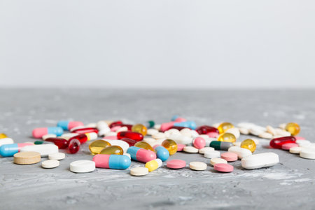 Collection Of Various Medical Tablets And Pills. Assorted pharmaceutical medicine pills, tablets and capsules on table background. Heap of assorted various medicine tablets. Health care.の写真素材