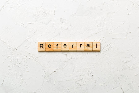Referral word written on wood block. Referral text for your design, Top view concept.の写真素材