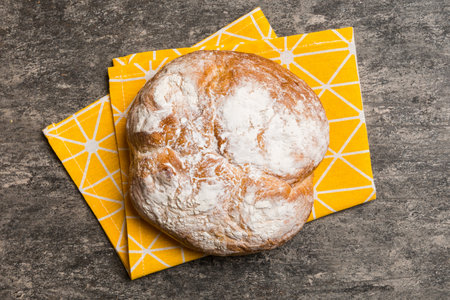 Fresh homemade crisp round bread on napkin, top view. Healthy unleavened bread. Top view Bakery products.の写真素材