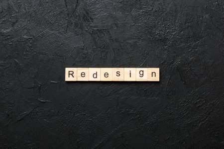 REDESIGN word made with wooden blocks concept.の写真素材