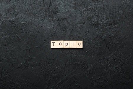 topic written word on wood block. topic text on table for your design, concept.の写真素材