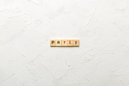 PARTY word written on wood block. PARTY text on cement table for your design, concept.の写真素材