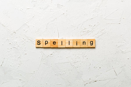 spelling word written on wood block.の写真素材