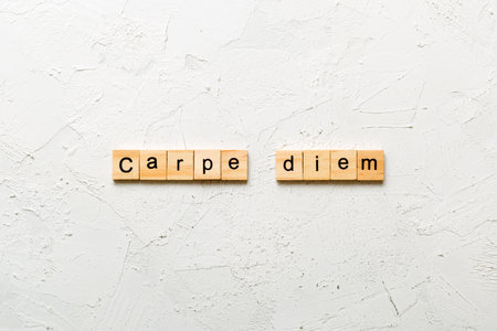Carpe diem word written on wood block. Carpe diem text on table, concept.の写真素材