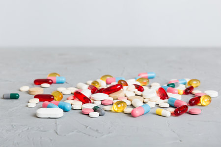 Collection Of Various Medical Tablets And Pills. Assorted pharmaceutical medicine pills, tablets and capsules on table background. Heap of assorted various medicine tablets. Health care.の写真素材