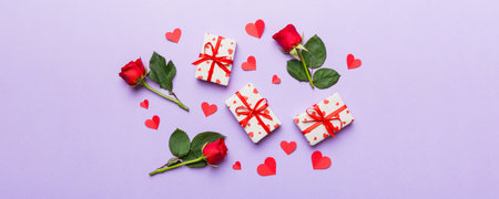 Kraft Gift box with beautiful red ribbon and rose, concept of Valentine day, anniversary, mother day and birthday greeting, copy space, top view.の写真素材