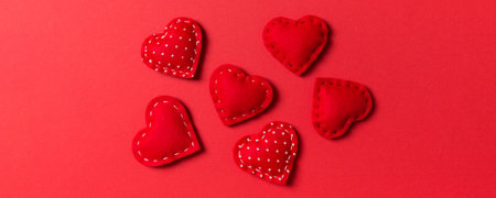 Composition of textile red hearts on colorful background. Close up view. Top view of St. Valentine's day concept.の写真素材