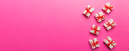 Valentine day composition: red gift box with bow and heart. Christmas present. View from above. Space for text. Holday greeting card.の写真素材