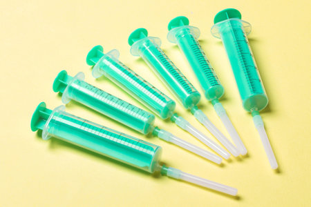 Top view of medical syringes on colorful background. Health care concept with copy space.の写真素材