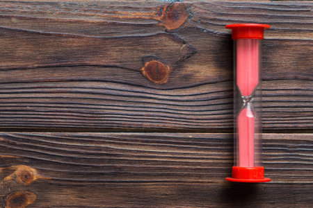 hourglass on the table, sand clock as time passing concept for business deadline, copy space.