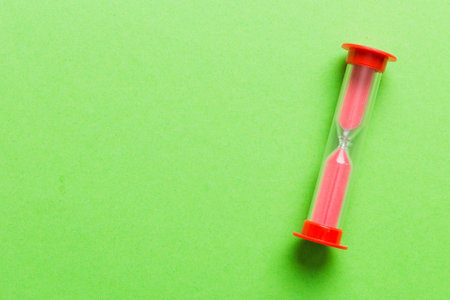 hourglass on the table, sand clock as time passing concept for business deadline, copy space.