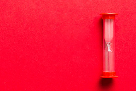 hourglass on the table, sand clock as time passing concept for business deadline, copy space.の写真素材