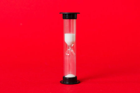 hourglass on the table, sand clock as time passing concept for business deadline, copy space.の写真素材