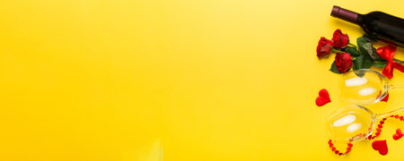 Valentine's day composition with red wine, rose flower and gift box on table. Top view, flat lay. Holiday concept.の写真素材