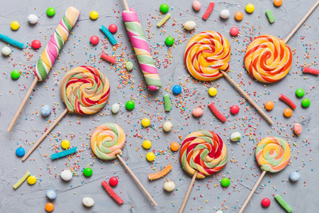 Tasty appetizing Party Accessories Happy Birthday Sweet. Different types of candies on colored...
