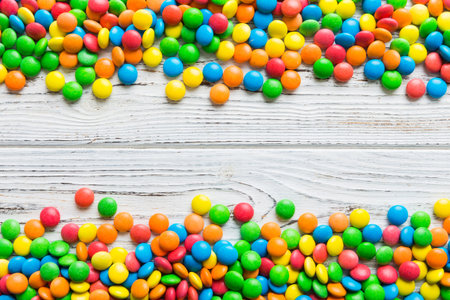 Mixed collection of colorful candy, on colored background. Flat lay, top view. frame of colorful...