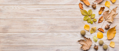 Autumn composition. Pattern made of dried leaves and other design accessories on table. Flat lay,...