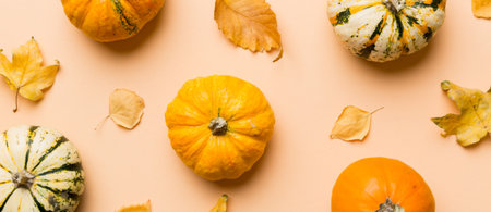 Autumn composition. Pattern made of dried leaves and other design accessories on table. Flat lay, top view.の写真素材