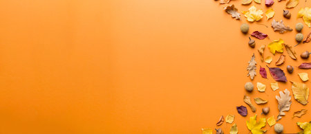 Autumn composition. Pattern made of dried leaves and other design accessories on table. Flat lay, top view.の写真素材