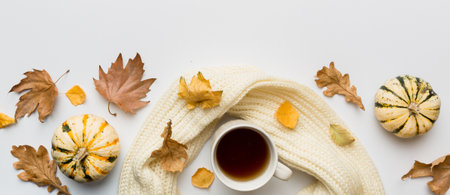 Flat lay composition with colorful Autumn cup of coffee and leaves on a color background. top view.