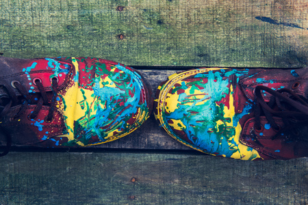 two color boots on wooden backgroundの写真素材