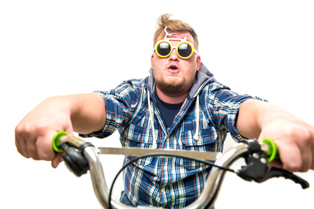 guy with glasses in a bike show emotionsの写真素材