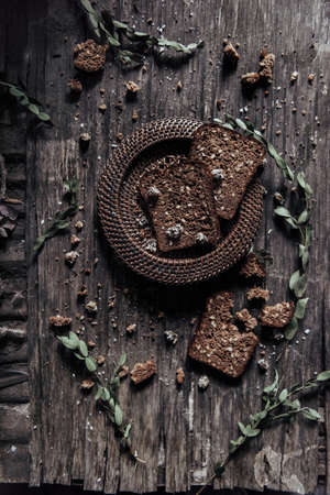 home made bread with bran on a wooden table style rusticの写真素材